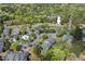 Aerial view of condo community with pool, parking, and surrounding trees at 3805 Chimney Ridge Pl # 003, Durham, NC 27713