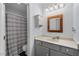 Bathroom featuring decorative mirror, tub, shower and single vanity at 3805 Chimney Ridge Pl # 003, Durham, NC 27713