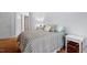 Cozy bedroom featuring a comfortable bed with checkered comforter and a neutral color scheme at 3805 Chimney Ridge Pl # 003, Durham, NC 27713