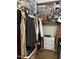 Walk-in closet with clothes, organizers, and wooden floor at 3805 Chimney Ridge Pl # 003, Durham, NC 27713