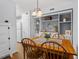 Bright dining area featuring a wooden table set, built-in shelving, and stylish decor at 3805 Chimney Ridge Pl # 003, Durham, NC 27713