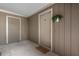 Home entrance with neutral door, storage closet, and hanging plant at 3805 Chimney Ridge Pl # 003, Durham, NC 27713
