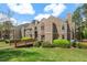 Inviting condo featuring well-maintained landscaping and a charming wooden walkway entrance at 3805 Chimney Ridge Pl # 003, Durham, NC 27713