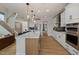 A well-equipped kitchen features an island with bar seating, stainless steel appliances, and modern cabinetry at 382 Belmont Stakes Ln, Wendell, NC 27591