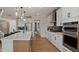 A well-equipped kitchen features an island with bar seating, stainless steel appliances, and modern cabinetry at 382 Belmont Stakes Ln, Wendell, NC 27591