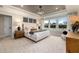 A spacious main bedroom features a tray ceiling, natural light, and elegant decor at 382 Belmont Stakes Ln, Wendell, NC 27591