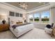 This is a light and airy main bedroom with tray ceilings, natural light, and neutral paint at 382 Belmont Stakes Ln, Wendell, NC 27591