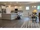 Bright, open kitchen featuring an island, modern appliances, and ample counter space at 4118 Rillcrest Grove Way, Fuquay Varina, NC 27526