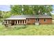 Brick home with a spacious backyard and a covered porch for outdoor entertaining at 428 Mitchell Ave, Franklinton, NC 27525