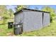 Outbuilding for storage with neutral paint, featuring trash receptacles at 428 Mitchell Ave, Franklinton, NC 27525