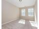 Empty bedroom featuring neutral colored walls, carpeted floors and natural light at 4901 Rose Quartz Way, Raleigh, NC 27610