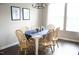 Dining area featuring a wooden table set with seating for six and large window at 4901 Rose Quartz Way, Raleigh, NC 27610