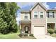 Charming townhouse features a well-kept lawn and a convenient one-car garage at 4901 Rose Quartz Way, Raleigh, NC 27610
