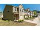 View of well-maintained townhomes with neatly landscaped yards and concrete driveways at 4901 Rose Quartz Way, Raleigh, NC 27610
