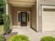 Covered front porch with sidelights by the door and a one-car garage at 4901 Rose Quartz Way, Raleigh, NC 27610