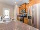 Kitchen with stainless steel appliances, granite countertops and a sink with a faucet at 4901 Rose Quartz Way, Raleigh, NC 27610