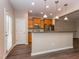 Open kitchen with stainless steel appliances and views to backyard at 4901 Rose Quartz Way, Raleigh, NC 27610