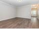 Spacious living room with wood-look flooring and ample natural light at 4901 Rose Quartz Way, Raleigh, NC 27610