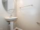 Powder room with pedestal sink, chrome fixtures, and neutral paint at 4901 Rose Quartz Way, Raleigh, NC 27610