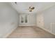 Serene bedroom with natural light, ceiling fan, and carpet flooring provides a comfortable personal retreat at 501 Finsbury Street # 103, Durham, NC 27703