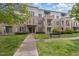 Attractive condo building with manicured lawn, walkway, and bench offers a comfortable and inviting place to live at 501 Finsbury Street # 103, Durham, NC 27703
