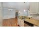 Charming kitchen open to dining and living spaces features granite counters and stainless steel appliances at 501 Finsbury Street # 103, Durham, NC 27703