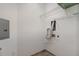 Practical laundry area with shelving and utility connections provides a dedicated space for laundry tasks at 501 Finsbury Street # 103, Durham, NC 27703