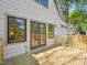 Charming house exterior with a wood porch, black double doors, and lots of sunlight at 511 Circle Dr, Burlington, NC 27215