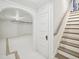 Unfinished basement with concrete floor, white walls, and stairs to the main floor at 511 Circle Dr, Burlington, NC 27215
