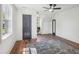Bedroom featuring a ceiling fan, hardwood floors, and bright windows at 511 Circle Dr, Burlington, NC 27215