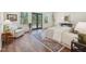 Cozy bedroom with access to the outdoors through French doors and a sitting area at 511 Circle Dr, Burlington, NC 27215