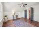 Bedroom featuring a ceiling fan, hardwood floors, bright windows, and a desk at 511 Circle Dr, Burlington, NC 27215