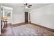Bedroom featuring a ceiling fan, hardwood floors, and bright white walls at 511 Circle Dr, Burlington, NC 27215