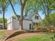 Beautiful house with a metal roof, back porch, stone retaining wall, and a lush lawn at 511 Circle Dr, Burlington, NC 27215