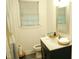 Bright bathroom with large vanity, stylish faucet, and full mirror at 513 Orange St, Oxford, NC 27565