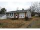 Traditional home with brick and siding exterior, offering a classic and inviting curb appeal at 513 Orange St, Oxford, NC 27565