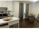 Updated kitchen, breakfast nook, and dining area with hardwood floors and stainless steel appliances at 513 Orange St, Oxford, NC 27565