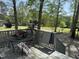 Outdoor deck with seating offering views of the grassy backyard at 5138 Nc 56, Franklinton, NC 27525