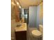 Compact bathroom with blue walls, vanity, and standard fixtures at 5138 Nc 56, Franklinton, NC 27525