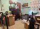 Untidy bedroom with green walls, a classic dresser, and lots of storage solutions, ideal for a creative space at 5138 Nc 56, Franklinton, NC 27525