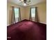 Simple bedroom with plush carpeting, ceiling fan, and natural light at 5138 Nc 56, Franklinton, NC 27525