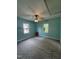 Spacious bedroom with light blue walls, ceiling fan, and large windows at 5138 Nc 56, Franklinton, NC 27525