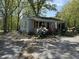 Charming single-story home surrounded by mature trees and colorful landscaping at 5138 Nc 56, Franklinton, NC 27525