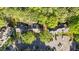 Overhead view of a home's setting amongst lush trees, with ample parking space at 541 Oak Run Dr, Raleigh, NC 27606