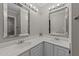 Bathroom featuring double sinks, vanity, and large mirrors at 541 Oak Run Dr, Raleigh, NC 27606