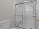 Bathroom featuring a glass-enclosed shower and built in bench seating at 541 Oak Run Dr, Raleigh, NC 27606