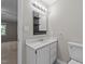 Bathroom vanity with decorative mirror and sink, and toilet at 541 Oak Run Dr, Raleigh, NC 27606