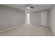 Bedroom with a ceiling fan, neutral paint, and view into the en suite bathroom at 541 Oak Run Dr, Raleigh, NC 27606