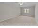 Bedroom featuring a neutral color palette with carpet, ceiling fan, and window at 541 Oak Run Dr, Raleigh, NC 27606