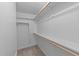 Walk-in closet with shelving and rods for organized storage at 541 Oak Run Dr, Raleigh, NC 27606